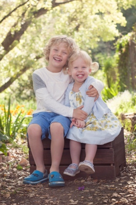 image of brother and sister hugging outdoors during portrait session by jessica michelle photo