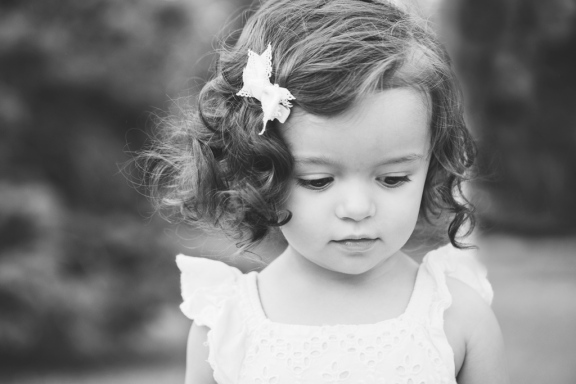 black and white portrait of girl looking down during photo session by jessica michelle photo